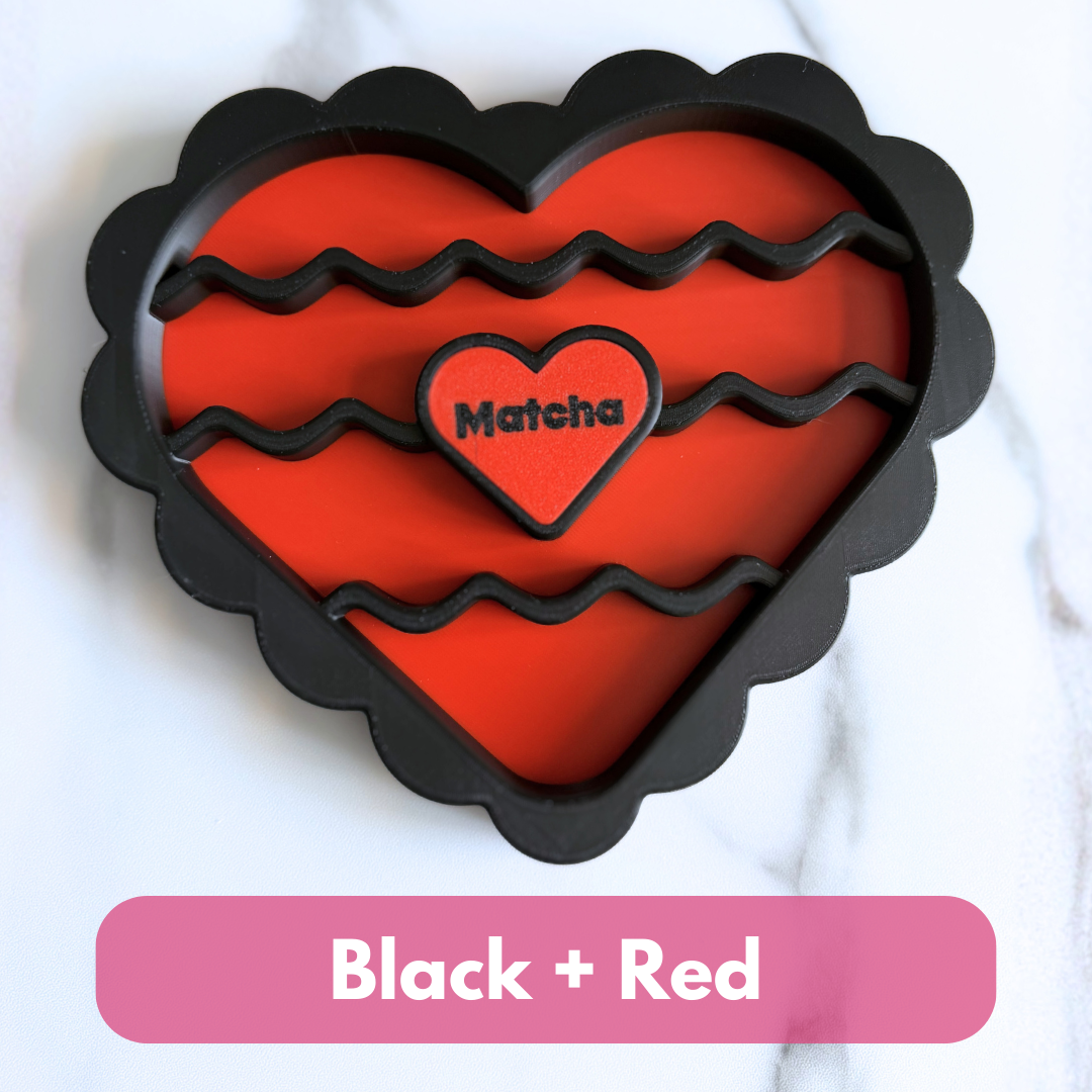 Heart-shaped cookie cutter with 'Matcha' text on a white background