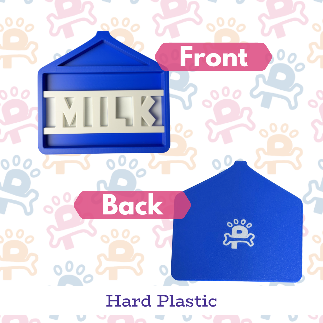 Blue hard plastic mold labeled 'MILK' on a patterned background