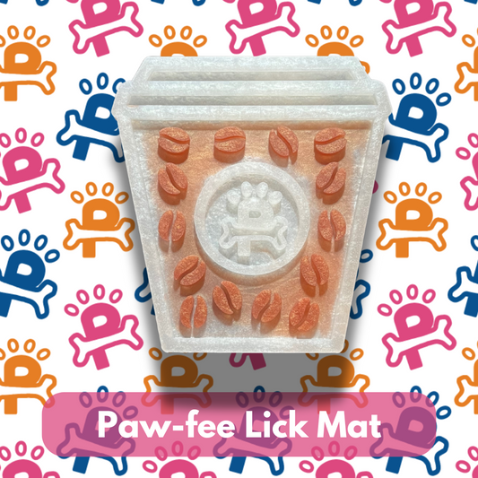 A lick mat with a paw print design, featuring raised textures and holes for spreading dog treats, displayed on a background with colorful paw prints.