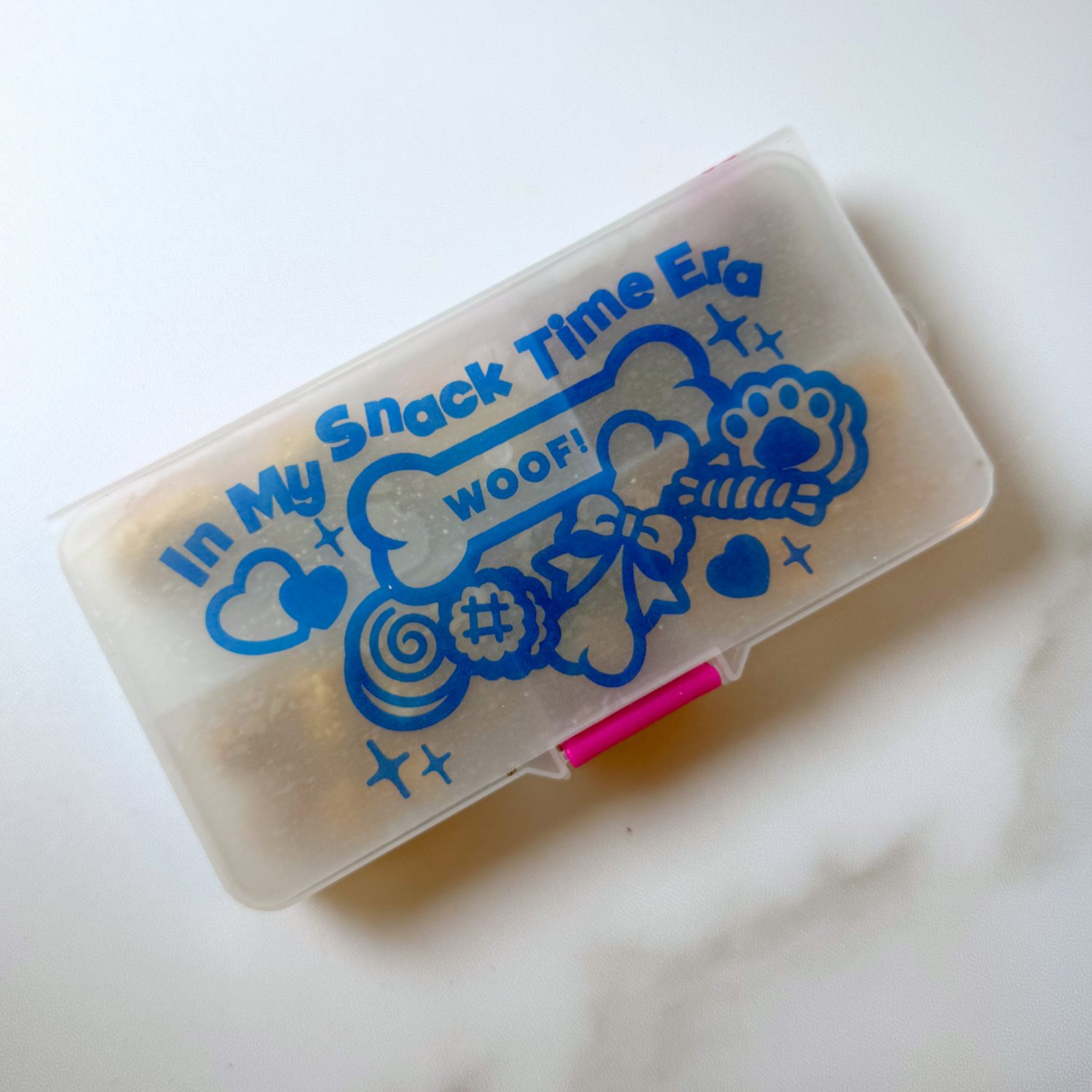 Clear container with blue text and graphics on a white background