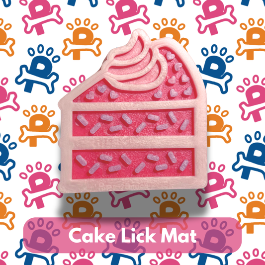 Pink cake-shaped lick mat with colorful paw print pattern in the background
