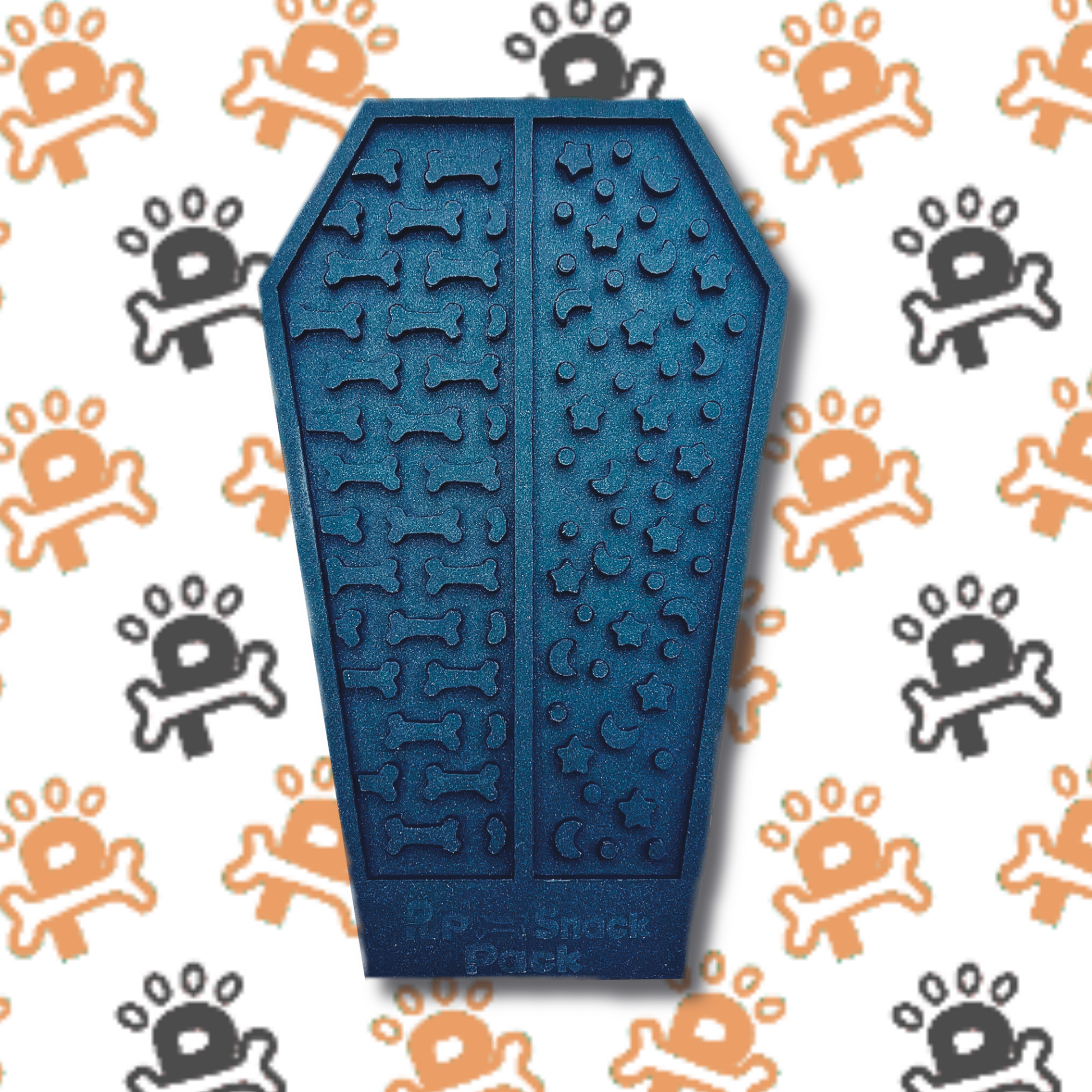 An silicone lick mat shaped like a coffin, featuring textured grooves and patterns designed to hold spreads like peanut butter or yogurt for dogs to enjoy