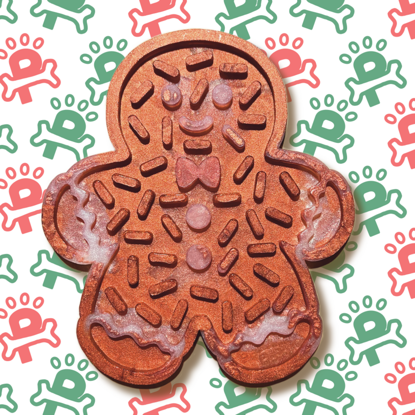 An silicone lick mat shaped like a gingerbread man, featuring textured grooves and patterns designed to hold spreads like peanut butter or yogurt for dogs to enjoy